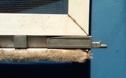 A customer submitted photo of a screen door side bolt.