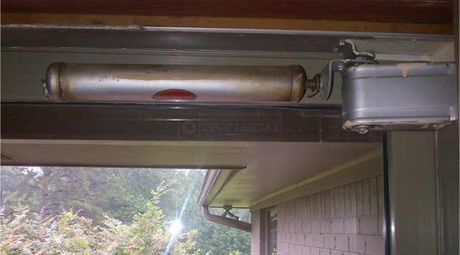 A customer submitted photo of a storm door closer.