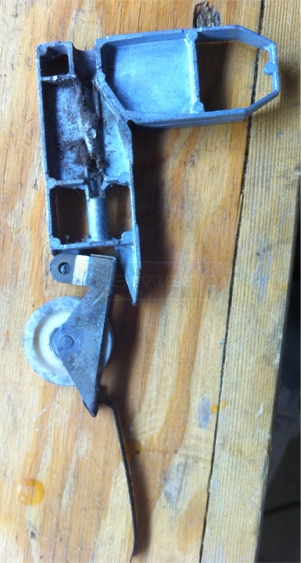 A customer submitted photo of a screen door roller.