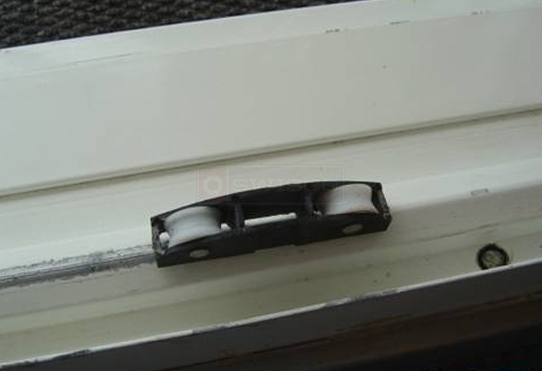 User submitted photos of a sliding door roller.