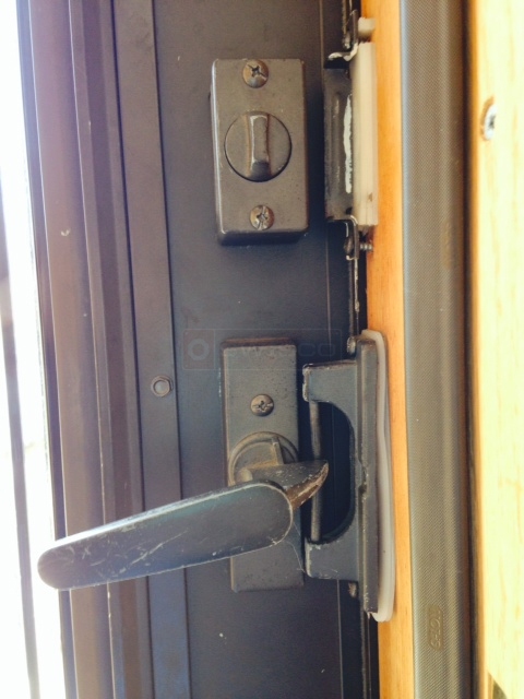 User submitted photos of storm door hardware.