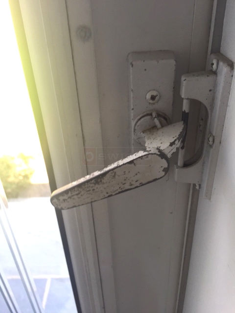 User submitted a photo of storm door hardware.