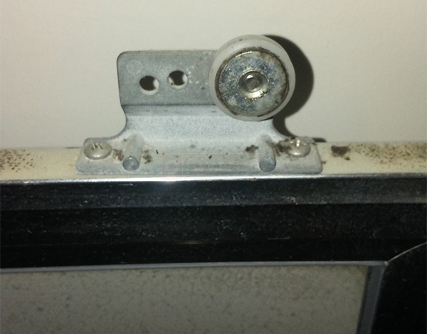 User submitted a photo of a shower door roller.