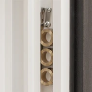 View of spring retainer and coils installed in a jamb