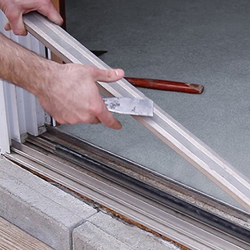 Lifting The Stationary Panel Out Of The Door Track