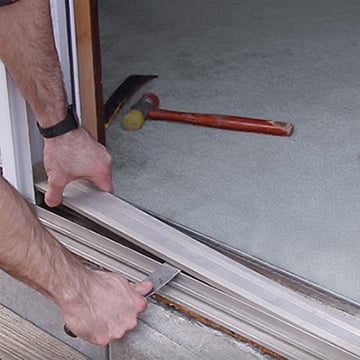 Removing The Stationary Panel With A Putty Knife