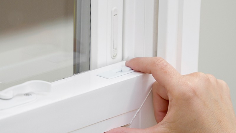 Unlatch the tilt locking mechanism on the the window sash.