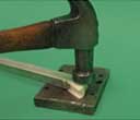 Flatten the new rivet in the channel balance.