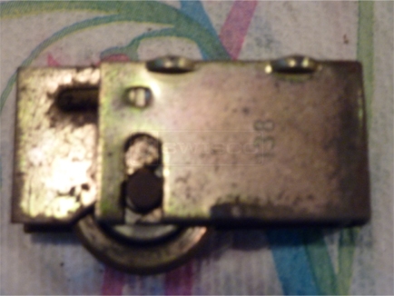 User submitted photo of sliding door roller stamped 138