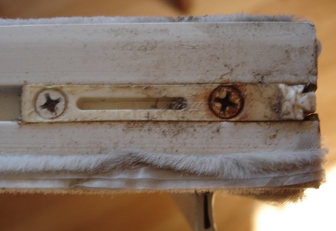 A customer submitted photo of a broken window latch.