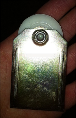 A customer submitted photo of a mirror door roller.