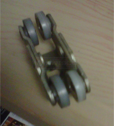 A customer submitted photo of a closet door roller.