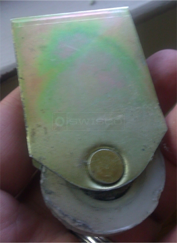 A customer submitted photo of a closet door roller.