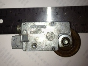 A customer submitted photo of a patio door roller.