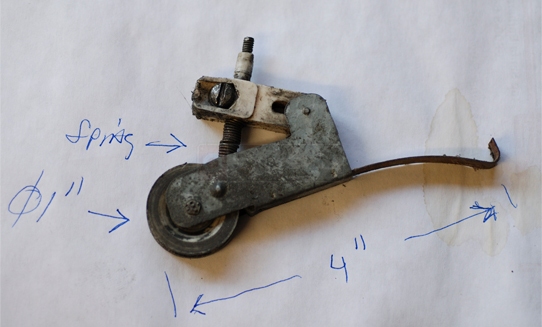 A customer submitted photo of a screen door roller.