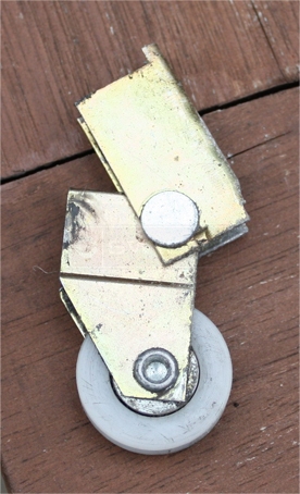 A customer submitted photo of a screen door roller.