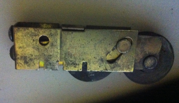 User submitted photos of a sliding door roller.