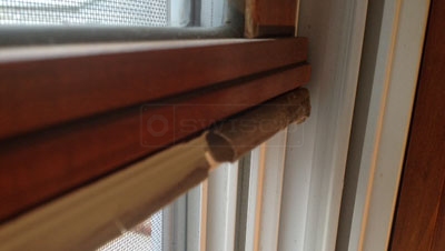 User image of their deteriorating Caradco weatherstripping.