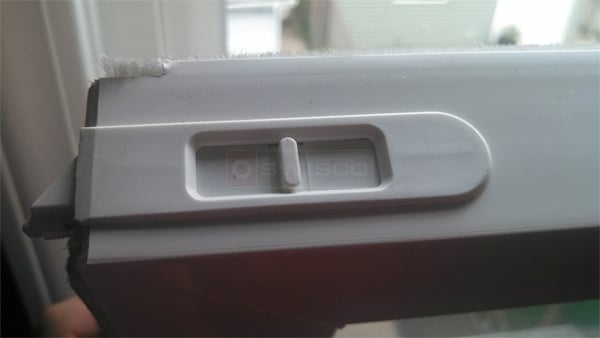 This is an internal latch on a nylon window : SWISCO.com
