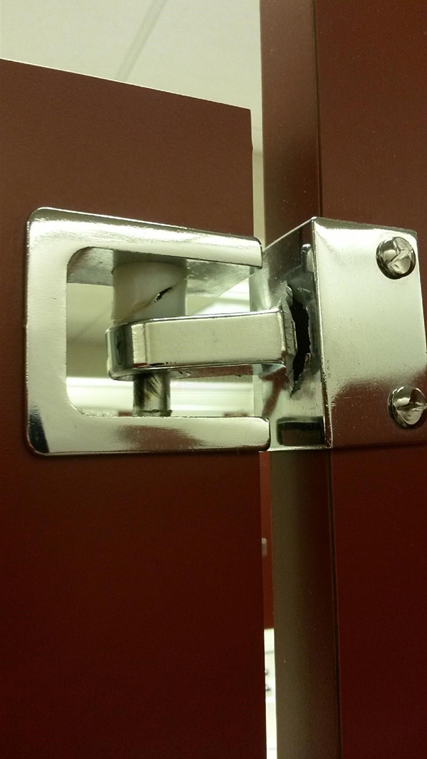 User submitted a photo of toilet partition hardware.