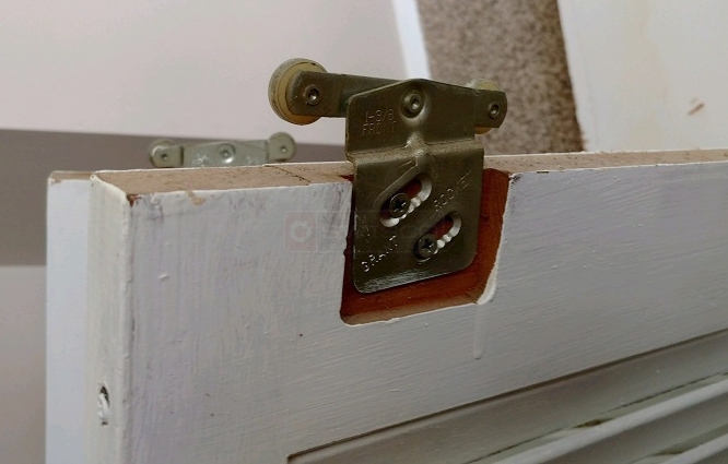 User submitted photos of closet door hardware.