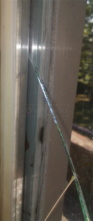 Broken outside window pane on a 24