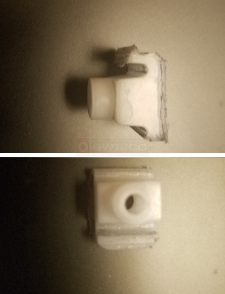 Broken part for a bottom mounted cabinet drawer
