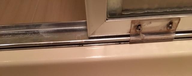 User submitted photos of shower door hardware.