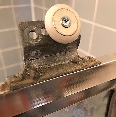 Sliding shower door roller