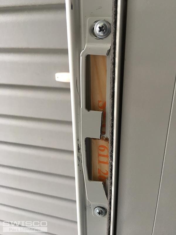 Storm door strike plate