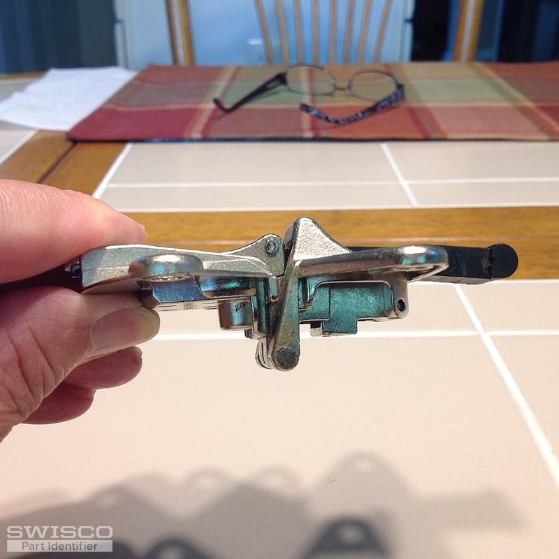 Mepla hinge that folds the two doors of a lazy Susan corner