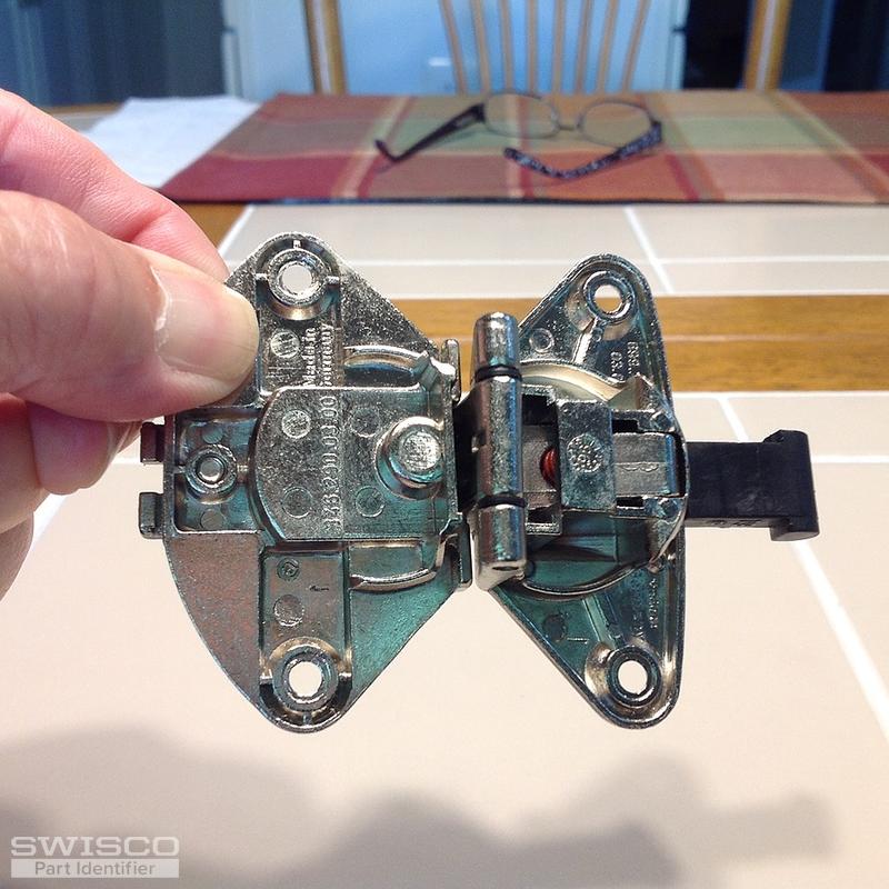 Mepla hinge that folds the two doors of a lazy Susan corner