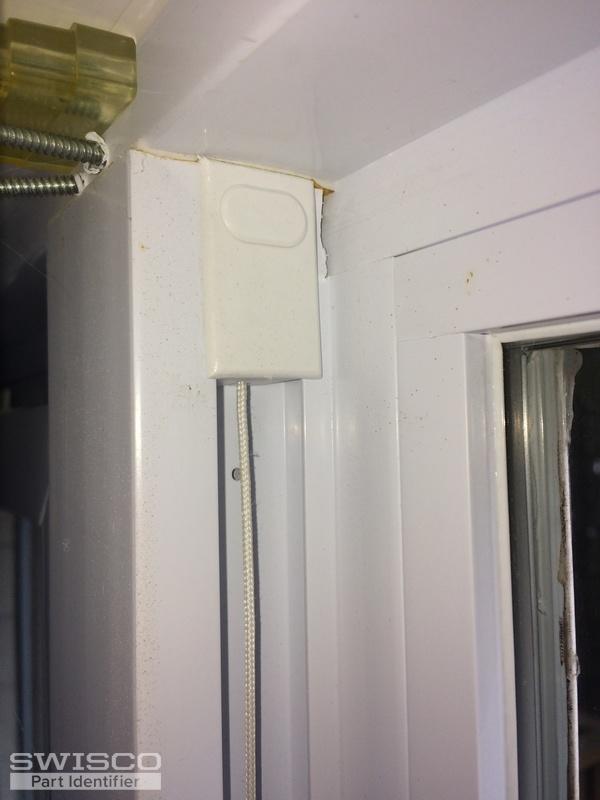Upper end; 2 screws under cover