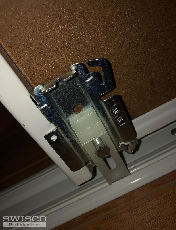 Bottom sliding closet door guide marked AN 20121