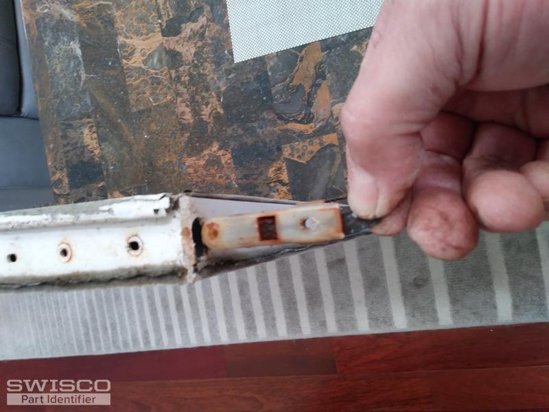 Plastic piece in the Sash holding the metal bar
