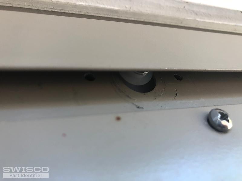 screws and rollers at top of door