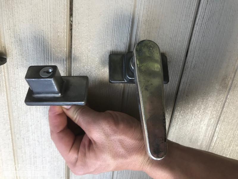 Storm door handle on glass sunroom door