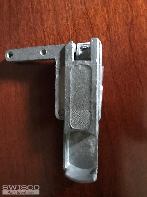 Storm door window retainer