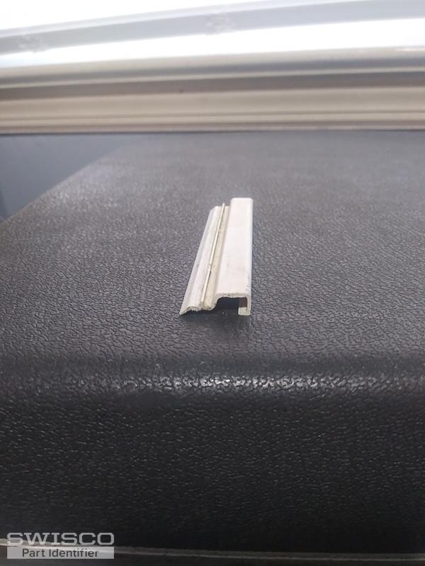 Snapin retainer strips for a full view storm door glass.