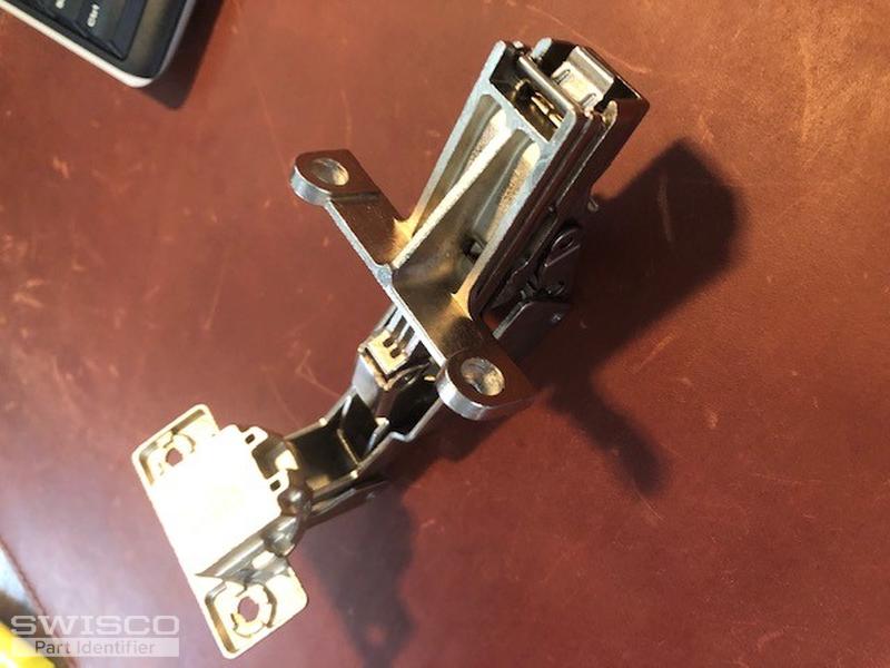 Replacement hinge for lazy susan door