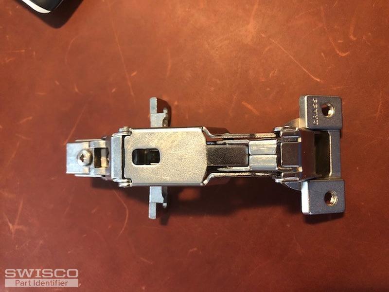 Replacement hinge for lazy susan door