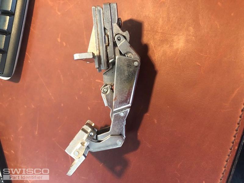 Replacement hinge for lazy susan door