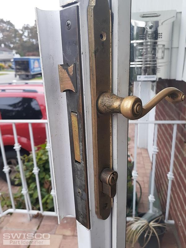 Storm door lock removal