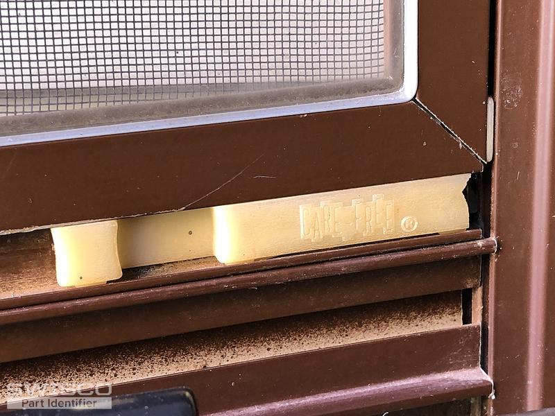 Storm door window latch