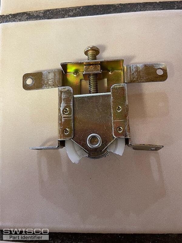 Older 30 yr wood mirrored sliding closet door wheel assembly