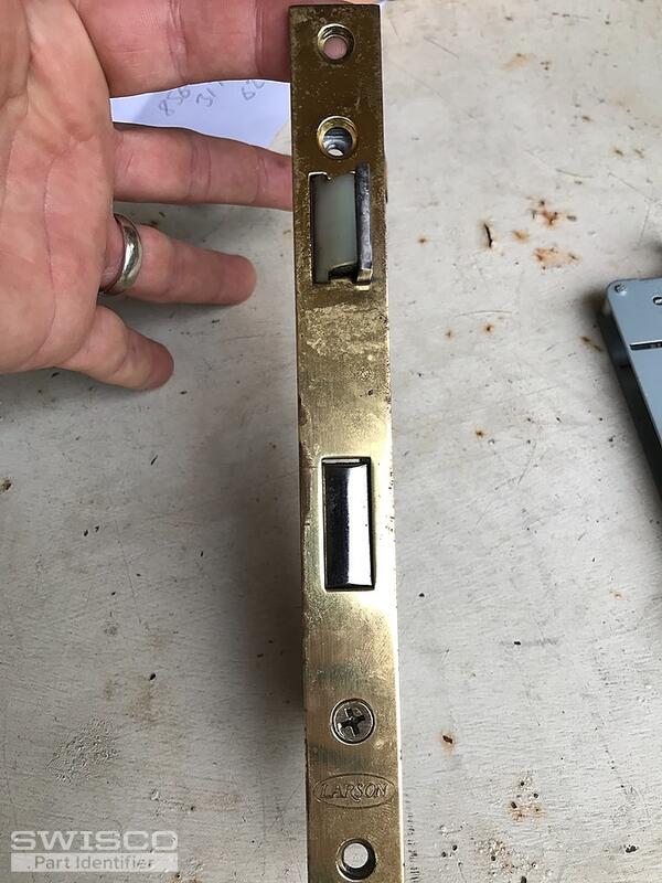 Storm door latch assembly