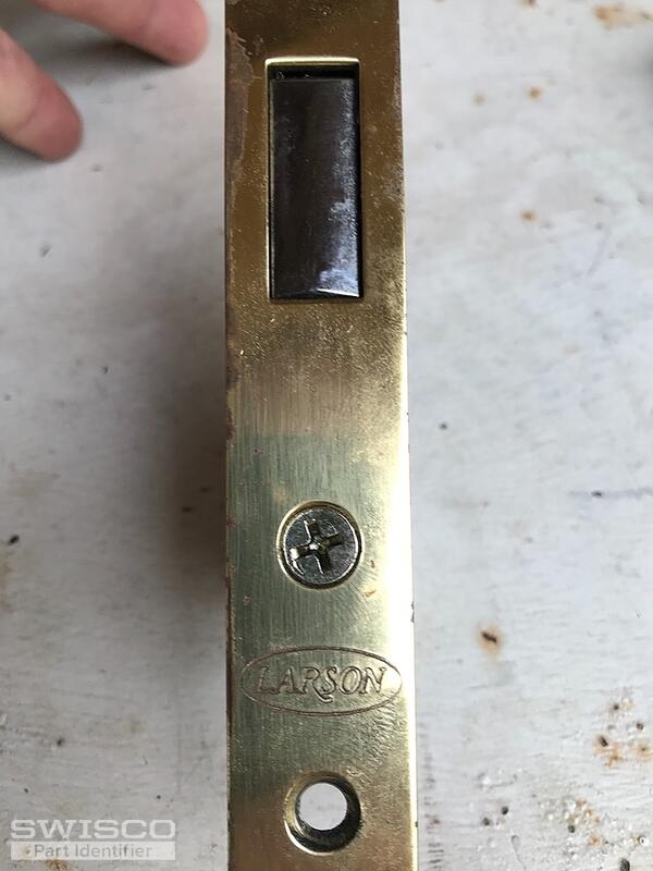 Storm door latch assembly