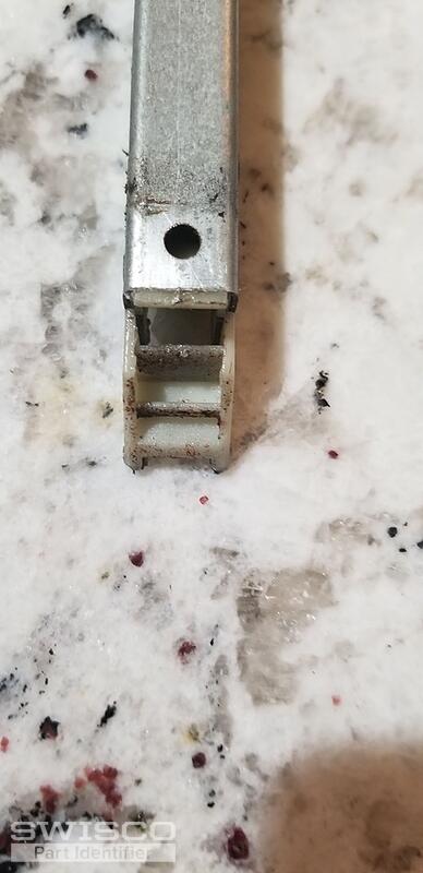 Top of channel catches on top of window hold down.
