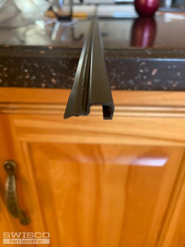 screen/window retaining strip for chamberdoor storm door