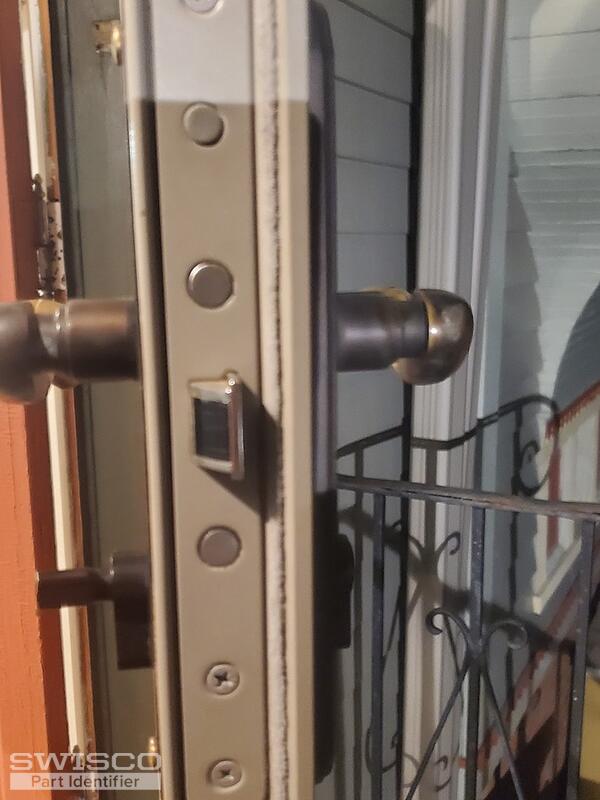 Storm door lock spins